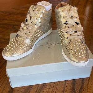 Cool, stylish gold studded sneakers.